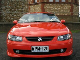 2002 Holden Monaro V2 CV8 Orange 4 Speed Automatic Coupe.
