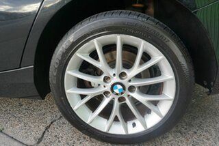 2014 BMW 1 Series F20 MY0713 118i Steptronic Black 8 Speed Sports Automatic Hatchback